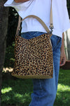 LEOPARD PRINT BUCKET BAG WITH LATTE BONE LEATHER.