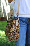 LEOPARD PRINT BUCKET BAG WITH LATTE BONE LEATHER.