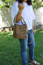 LEOPARD PRINT BUCKET BAG WITH LATTE BONE LEATHER.