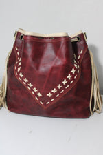 BONE AND WINE LEATHER FRINGE BUCKET BAG